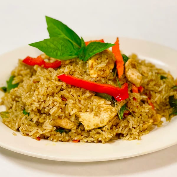 Siri Thai Cuisine's green curry fried rice with chicken, red bell peppers, and basil.